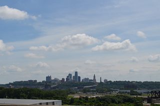Motorists are afforded an unobstructed view of the Downtown Kansas City, Missouri skyline as I-670 hugs a bluff line overlooking the Armourdale industrial area along the Kansas River.
