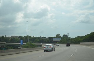 The three lane viaducts of Interstate 670 separate as the Dillingham Freeway passes over I-70 at Pacific Avenue.
