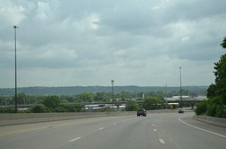 U.S. 169 branches south from I-70 across the distant 7th Street Viaduct. U.S. 69 south joins I-70 west from 7th Street to the north as I-670 traffic merges after Mill Street.