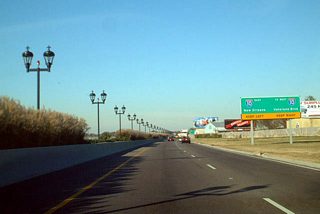 Approaching the partition of traffic for Veterans Boulevard and the eastbound flyover to Interstate 10 on Airport Road north.