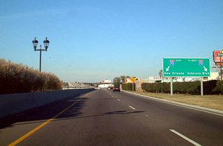 Entering the half diamond interchange with Veterans Boulevard on Airport Road north. There is no direct access to I-10 west. Instead motorists must take Veterans Boulevard east to LA 49 (Williams Boulevard) north and access the freeway there.