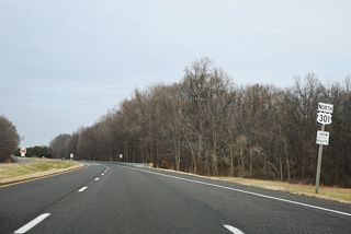 A distance sign referencing Wilmington at 51 miles beyond this confirming marker was removed by 2018.