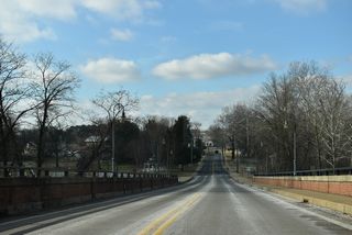 West from MD 313 (Greensboro Road), MD 314 (Sunset Avenue) lowers cross the Choptank River on a bridge built in 1995.