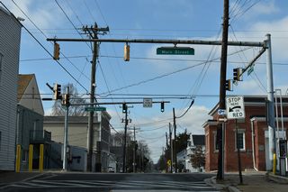 0.36 miles west of MD 313 (Goldsboro Road), MD 314 (Sunset Avenue) intersects MD 480 (Main Street) at Downtown Greensboro. MD 480 is not signed along either direction of Sunset Avenue.
