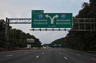 Two lanes separate from I-495 north at the wye interchange (Exit 38) with Interstate 270 Spur north. Signed as either I-270 or "TO I-270", the I-270 Spur links with I-270 in two miles.
I-270 Spur was previously  designated as I-270 when the I-270 mainline was Interstate 70S and U.S. 240. I-70S was decommissioned in 1973.