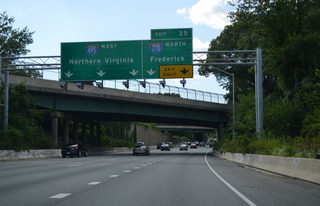 A split Rockville Pike (MD 355) passes above I-495 as Exit 35 separates for Interstate 270 west. I-270 travels west initially, meeting MD 187 south of Montrose, before turning northwest to Rockville, Gaithersburg and Frederick.