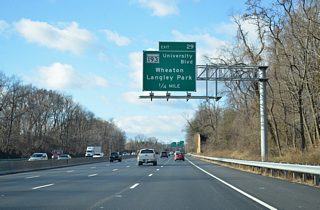 Sound walls reappear along Interstate 495 as the freeway exits Northwest Branch Park between the subdivisions of Franklin Hills and Indiana Spring Village. Exit 29 departs in one quarter mile for MD 193 (University Boulevard).