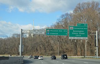 Interstate 495 curves around the periphery of Rock Creek on the one mile approach to MD 185 (Connecticut Avenue). Connecticut Avenue carries the state route northward from Washington through Chevy Chase and Kensington, meeting the freeway at the six-ramp parclo interchange (Exit 33).