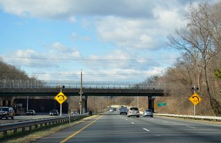Entering the wye interchange with Interstate 270 Spur south, westbound drivers along I-495 make a sharp southward turn.