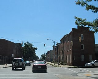 Fayette Street crosses Martin Luther King, Jr. Boulevard and enters Lexington Terrace, intersecting Fremont Avenue. Fremont Avenue's role has depreciated over the years due to construction of the six lane MLK Boulevard and the U.S. 40 (former Interstate 170) freeway.