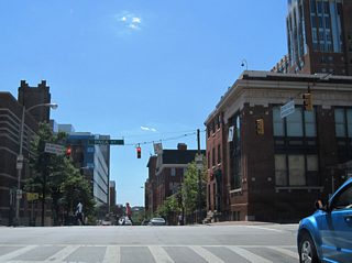 Paca Street doubles as MD 295 northbound from Oriole Park at Camden Yards to U.S. 40 (Franklin / Mulberry Streets). Fayette Street intersects the northbound-only street in this scene.