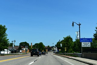 A welcome center is located ahead of 13th Street within Menominee. 