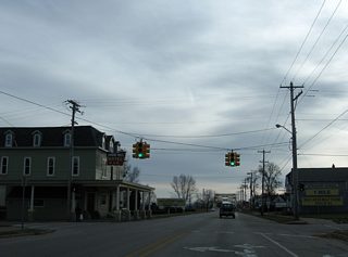 Water Street curves southward as Johnston Street to cross paths with Business Spur I-75 at this set of traffic lights.