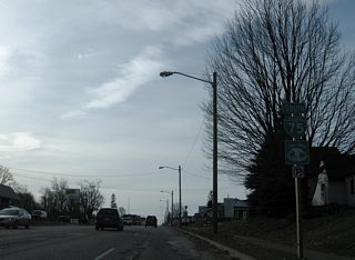 Business Spur I-75 expands to four lanes south from Easterday Avenue. The road rises onto a ridge and kinks southward after James Street.