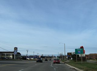 Interstate 75 appears as Business Spur I-75 passes by Cascade Crossings Shopping Center.