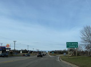 Entering the parclo interchange with Interstate 75, drivers bound for Easterday Avenue in Sault Ste. Marie or the International Bridge to Ontario depart Business Spur I-75 south.