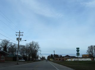Riverside Drive becomes East Portage Avenue at Mission Road and this reassurance marker.