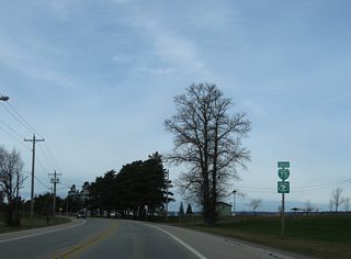 The first shield for Business Spur I-75 appears west of the Sugar Island ferry dock as Riverside Drive lines Sault Ste. Marie Country Club.