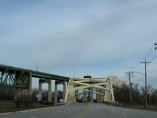 A steel arch bridge carries West Portage Avenue across the Edison Power House Canal next to the International Bridge. The 260-foot long bridge was built in 1970.2