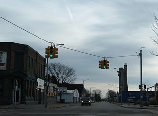 Business Spur I-75 overtakes East Portage Avenue from Ashmun Street at the next signal. Ashmun Street north to Water Street east was the former eastern extent of U.S. 2 to the ferry docks that linked with Sault Ste. Marie, Ontario.1