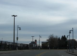 West Portage Avenue turns eastward parallel to the South Canal of the Soo Locks en route to Downtown Sault Ste. Marie. The Soo Locks consist of parallel canals and locks enabling ships to bypass St. Marys Falls and its associated rapids.