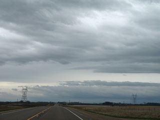 Transmission lines span MN 28 near Spooner Slough.