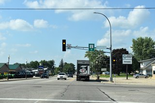 CR 6 travels along 6th Street S three miles west to an interchange with I-90 at the community of High Forest.