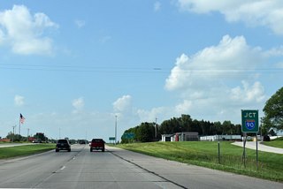 Beyond Schumann Drive NW U.S. 63 / Highway 30 meet Interstate 90 at a parclo B4 interchange.