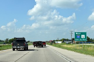 Highway 30 leaves U.S. 63 one half mile ahead for RST Airport and Hayfield.