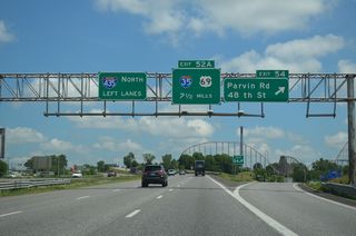 I-435 crosses paths with its parent route in 2.5 miles as Exit 54 parts ways with the beltway north. Parvin Road leads west to and east to Great Midwest Industrial Park. 48th Street connects the freeway with the Gracemor-Randolph Corners and Maple Park suburbs.