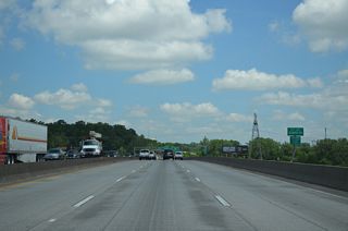 Built in 1972, the I-435 bridge across the Missouri River was restriped to accommodate six lanes in place of inside or outside shoulders. The river marks the Clay County line.