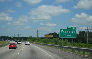 Interstate 435 angles northwest across a series of bridges spanning the BNSF, KCT and Union Pacific Railroads and the Blue River to Exit 57 for Front Street.