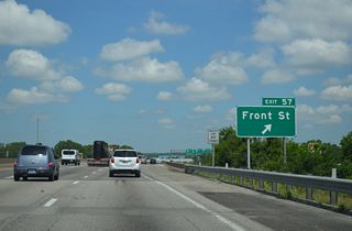 Exit 57 departs from the beltway north for Front Street east to the KCP&L Hawthorn Generating Station and west to the Northeast Industrial District and Riverfront Park.