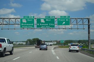 Construction in 2013 converted Exit 57 into a diverging diamond interchange (DDI). North from Front Street, I-435 advances to the industrial city of Randolph and Route 210 at Exit 55.