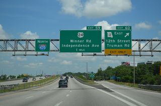 Truman Road extends west from Exit 60 and Route 12 to the Blue Valley neighborhood of Kansas City en route to Downtown. Independence Avenue (former U.S. 24) parallels the boulevard to the north by the Sheffield and Lykins communities.
