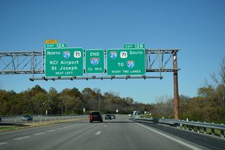 Interstate 635 climbs onto the Missouri River bluff line ahead of I-29/U.S. 71. I-29 runs northwest through Northland in Kansas City to Kansas City International Airport (MCI), Platte City and St. Joseph.