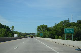 Motorists cross the Kansas state line midway across the Missouri River on Interstate 635 southbound.