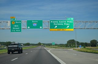 The diamond interchange (Exit 9) with Horizons Parkway opened in December 2008 for the newly developed Horizons business park. Argosy Casino Parkway was added a year later from the south to connect I-635 with the nearby casino.