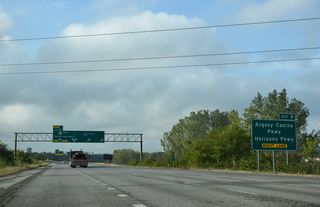 A left side ramp brings U.S. 69 south onto Interstate 635 as the freeway travels between Argosy Casino and Horizons business park. Exit 9 provides access to both areas in 1.1 mile.