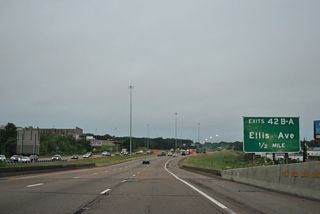 Curving west, I-20/U.S. 49 span Raymond Road and Lynch Creek ahead of Exit 42 for Ellis Avenue.