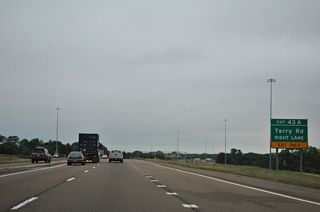 The six-ramp parclo interchange (Exit 43) with Terry Road lies just beyond the west split of I-20/55.