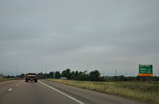 Guide signs for Exit 45A formerly referenced U.S. 51 north. State Street enters a folded diamond interchange with U.S. 80 to the immediate north en route to Downtown Jackson.