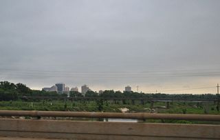 The Jackson skyline appears to the northwest beyond the parallel U.S. 80 bridge over the Pearl River.