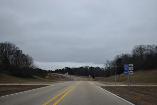 Landfill Road meets I-22/U.S. 78 east at Exit 26, just ahead of a parclo B2 interchange with MS 178.