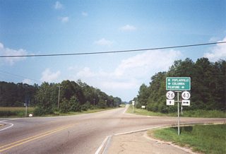 Navigating along a series of S-curves by Old River and Moodys Lake, MS 26 emerges from wetland areas along the Pearl River at MS 43 north of Crossroads. MS 43 parallels the Pearl River north to Columbia and south to Picayune.