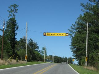MS 26 rises to 169 feet above sea level at the upcoming traffic light with MS 57.  The bluffs rise west of the Pascagoula River.