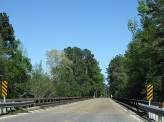 A flood relief bridge follows to the east of Hutson Lake on Mississippi 26.