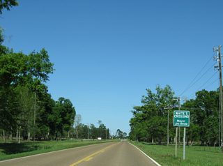 Big Four Road south and City Bridge Road north come together at the settlement of Whites Crossing along Mississippi 26 east.