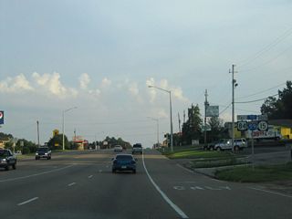 Leading U.S. 84/MS 15 south to Interstate 59, 16th Avenue constitutes a five lane commercial boulevard.