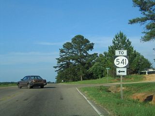Clem Road south and Mount Carmel Road north come together at the settlement of Mount Carmel along U.S. 84. Clem Road leads 6.19 miles north to become MS 541. MS 541 travels 11.02 miles to MS 28 west of Magee.